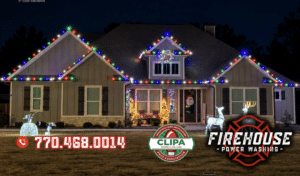 Firehouse crew installing Christmas lights on a roofline in Peachtree City, GA
